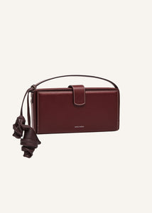 Apolonia bag in burgundy leather with flower charm