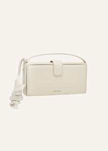 Apolonia bag in cream leather with flower charm