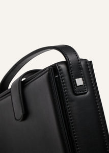 Apolonia bag in black leather with flower charm