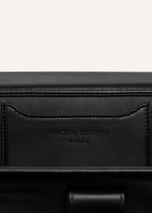 Apolonia bag in black leather with flower charm