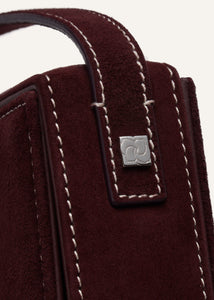Apolonia bag in burgundy suede with flower charm