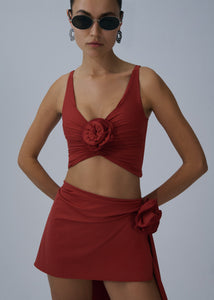 Asymmetrical draped swim skirt in red