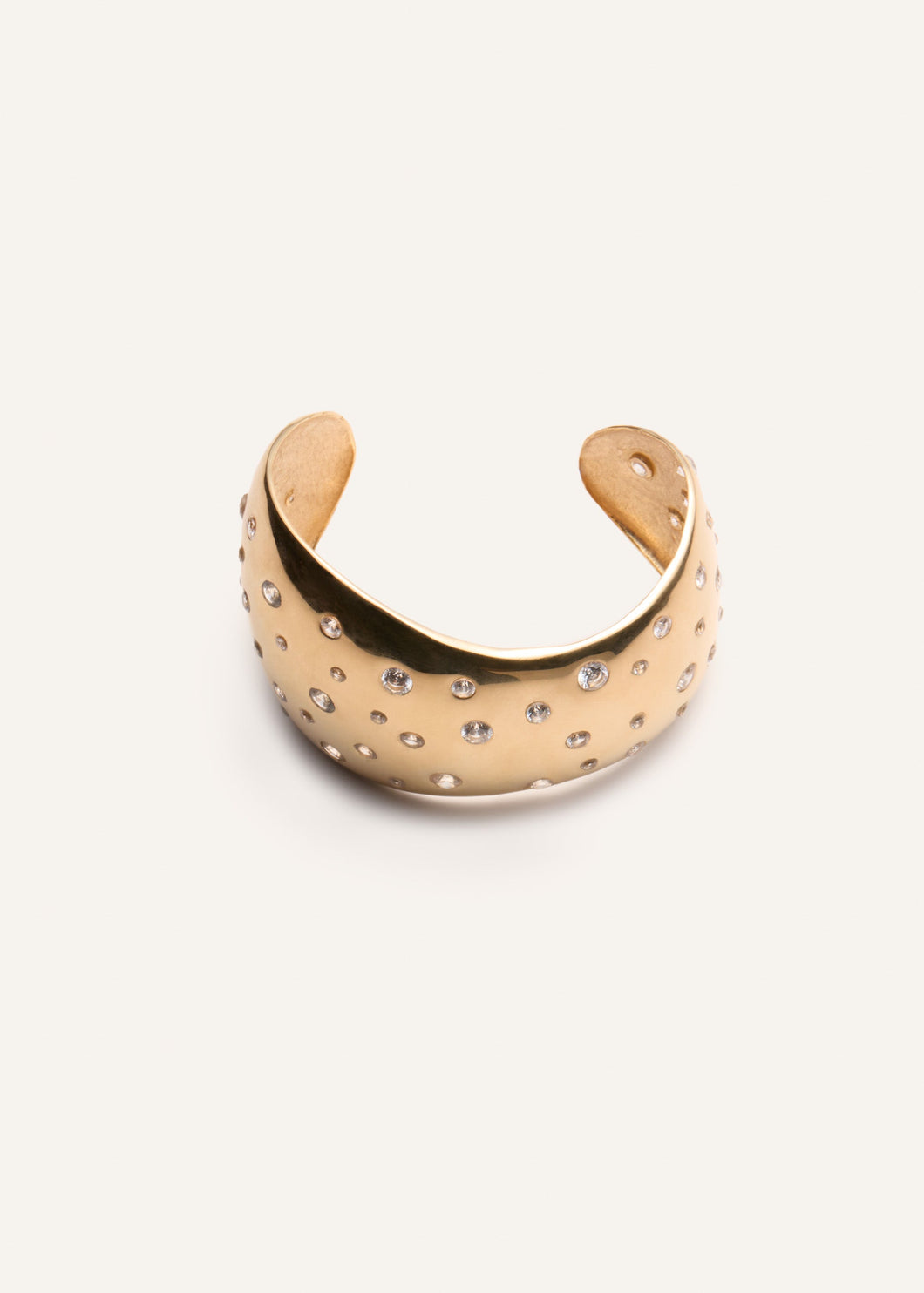 Crystal-studded bracelet in gold