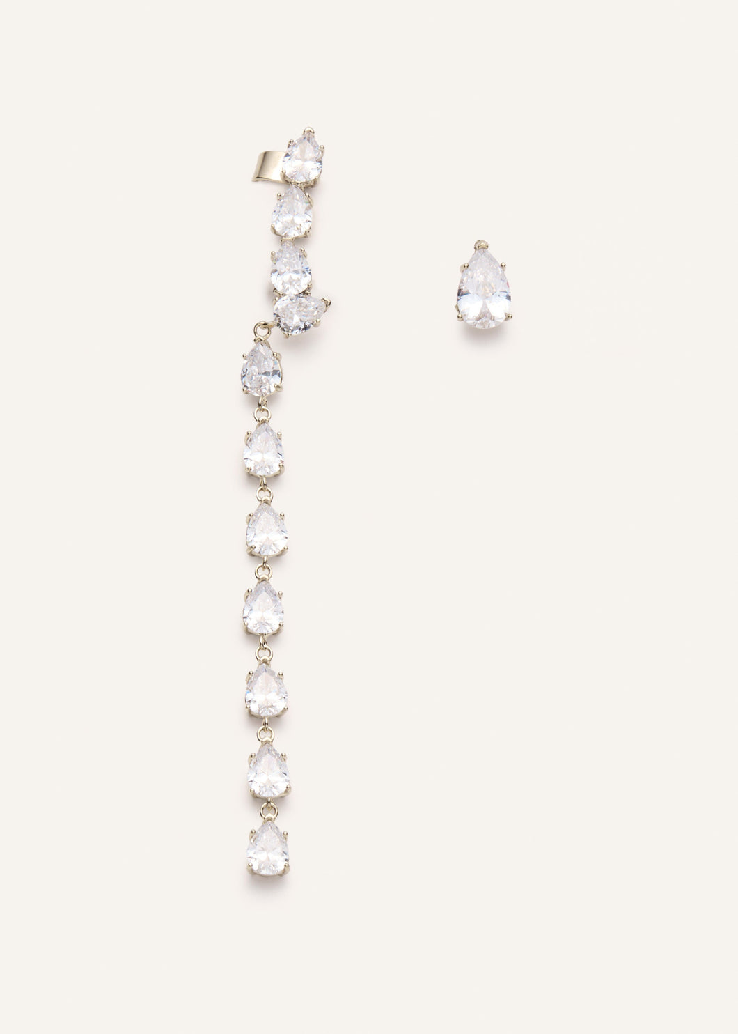 Asymmetrical crystal drop earring set in gold
